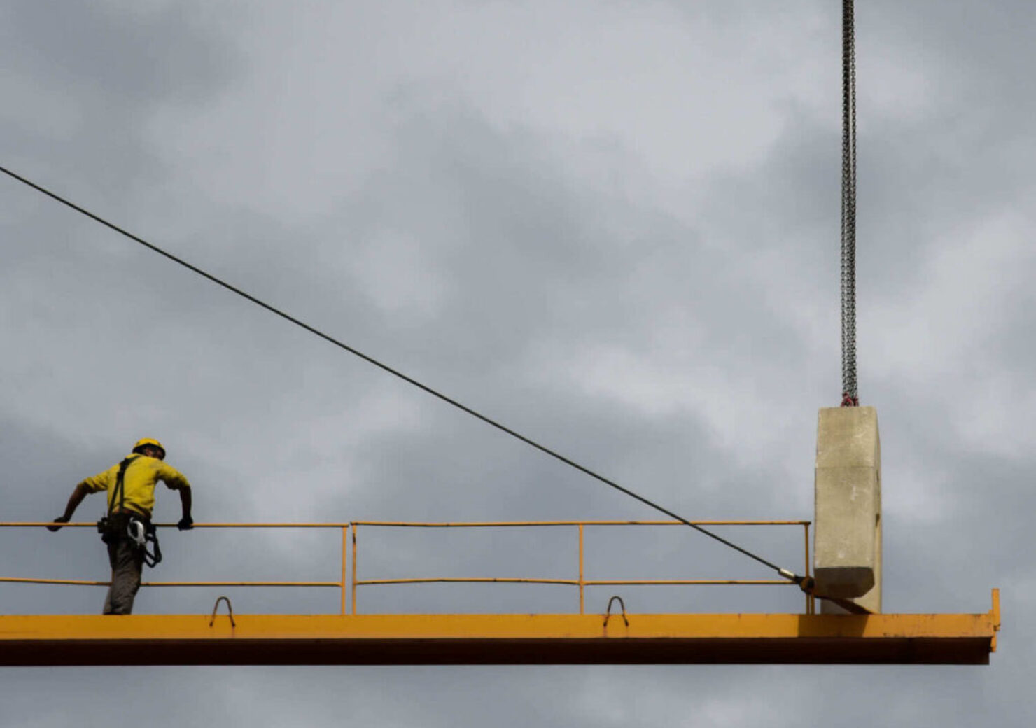 man-stand-on-crane